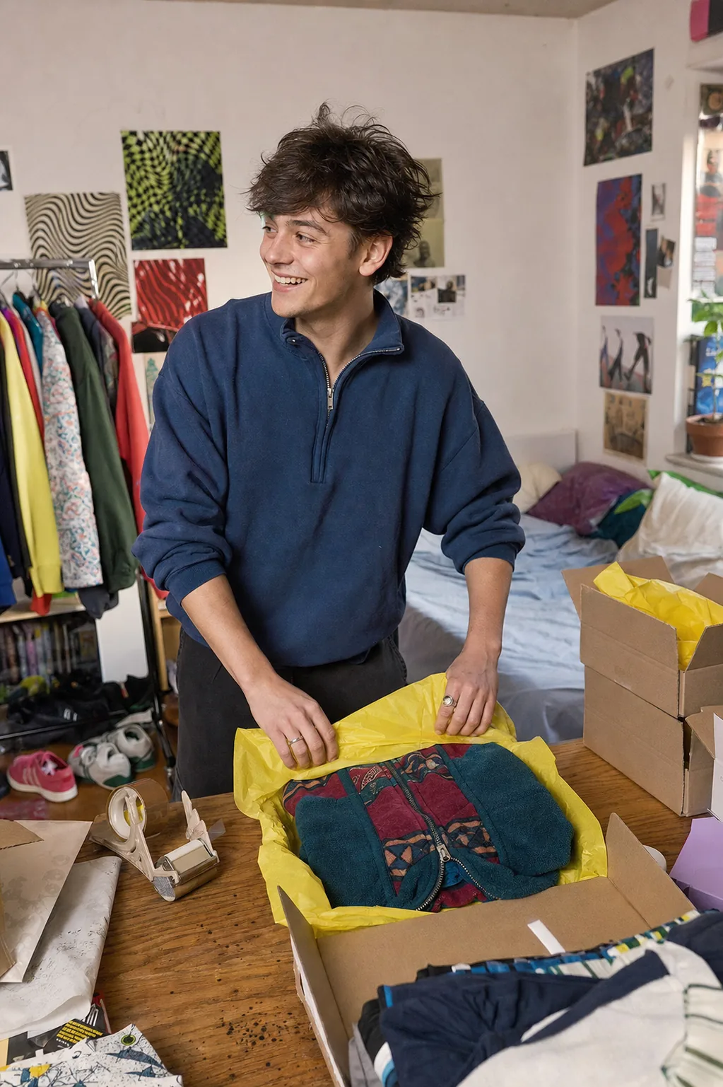 Young founder packing an online order